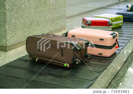 Travel suitcase at the international airport Travel suitcase at the international airport 72693881