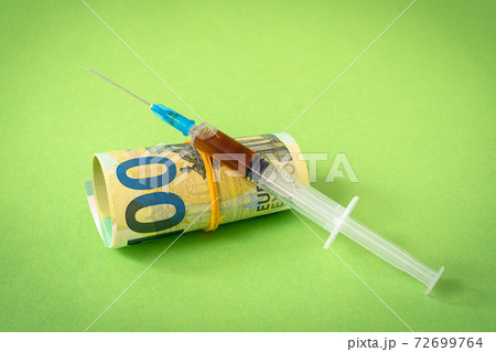 Euro currency with syringe 72699764