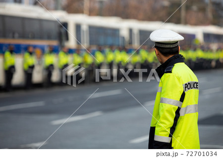 Police officers an demonstration Police officers an demonstration 72701034