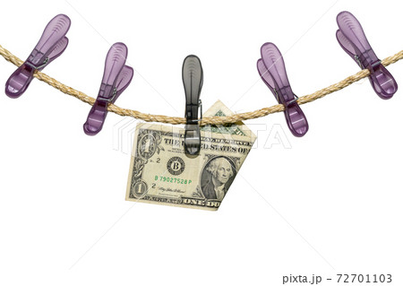 One US Dollar bill note on a washing line One US Dollar bill note on a washing line 72701103