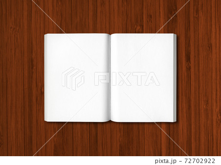 Open book isolated on dark wooden 72702922