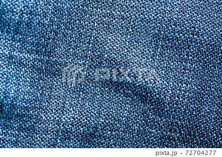 Striped textured blue jeans fabric background 72704277