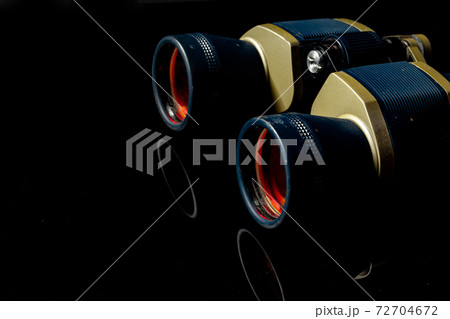 Military binoculars on black background close up 72704672