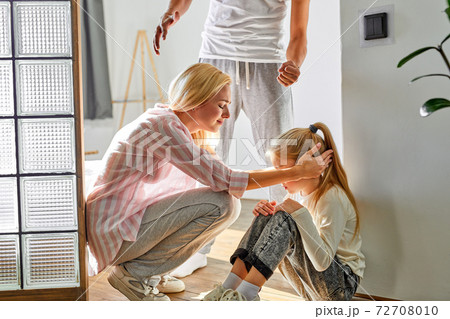 caucasian woman with a child endure her husband's disgusting behavior in the house 72708010