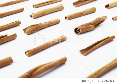 Cinnamon close up on a white background Cinnamon close up on a white background 72708763
