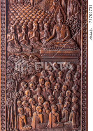 The image of Buddha's life is carved on the door of entrance the Buddhist temple Asokaram, Thailand. 72709755