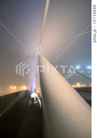 bridge over water whit fog 72710688
