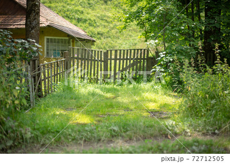 Old wooden rural house in a mountainous area in the Carpathians. Old wooden rural house in a mountainous area in the Carpathians. 72712505