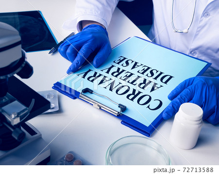 The medic reads about Coronary artery disease CAD. The medic reads about Coronary artery disease CAD. 72713588