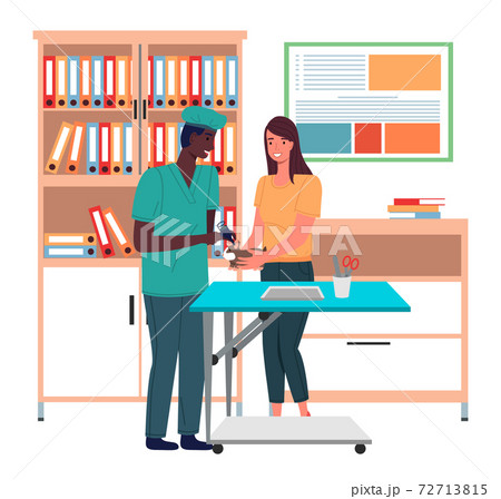 The veterinarian examines the ears of the guinea pig. The owner holds the pet during treatment 72713815