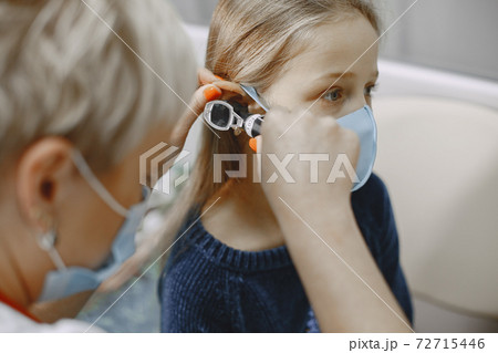 Happy little girl at the doctor for a checkup Happy little girl at the doctor for a checkup 72715446