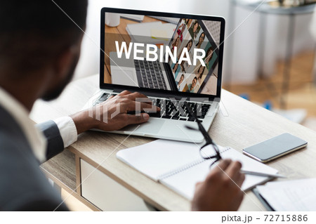 Businessman Using Laptop, Watching Webinar While Working In Modern Office 72715886