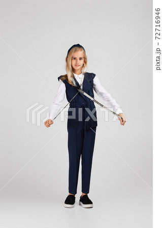 happy little girl holding tape measure happy little girl holding tape measure 72716946