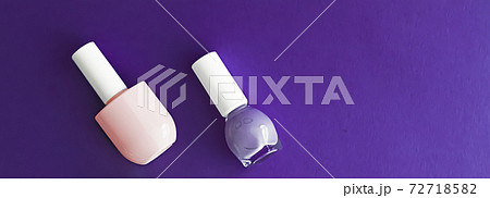Nail polish bottles on dark purple background, beauty brand Nail polish bottles on dark purple background, beauty brand 72718582
