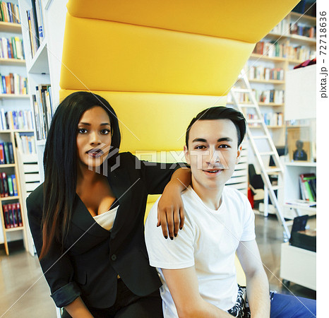 couple students in univercity library, looking book, preparing to exam, having fun, making selfie, lifestyle people concept 72718636