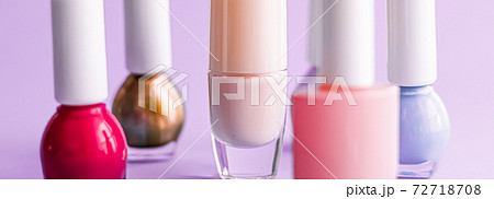 Nail polish bottles on purple background, beauty brand Nail polish bottles on purple background, beauty brand 72718708