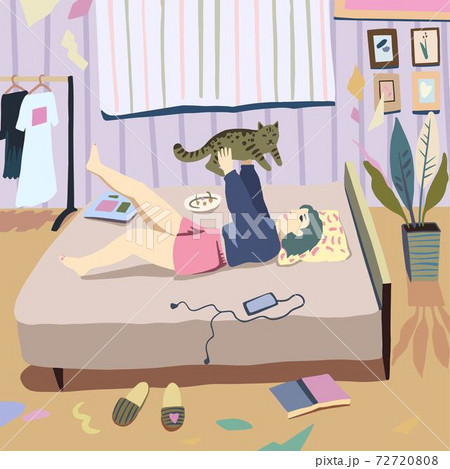 Young woman with her pet, tabby cat, have the rest in bedroom. 72720808