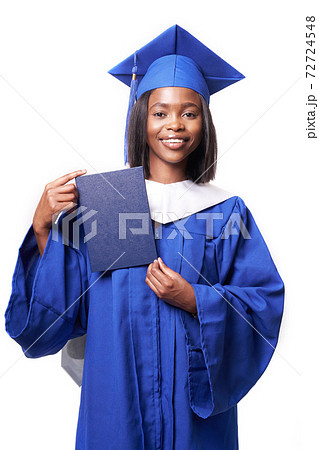 Black woman in a blue robe on a white background smiles and shows diploma 72724548