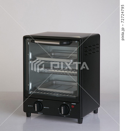 Electric small kitchen oven isolated on white Electric small kitchen oven isolated on white 72724795
