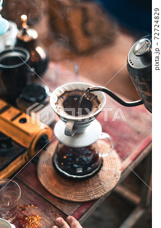 Drip coffee, barista pouring water on coffee ground with filter 72724829