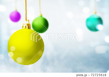 Colorful Christmas ball hanging with blurred light background Colorful Christmas ball hanging with blurred light background 72725618