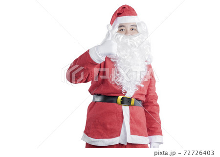 Asian man in Santa costume showing thumbs up standing Asian man in Santa costume showing thumbs up standing 72726403