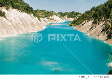 Volkovysk chalk pits or Belarusian Maldives beautiful saturated blue lakes. Famous chalk quarries near Vaukavysk, Belarus. Developed for the needs of Krasnaselski plant construction materials. Volkovysk chalk pits or Belarusian Maldives beautiful saturated blue lakes. Famous chalk quarries near Vaukavysk, Belarus. Developed for the needs of Krasnaselski plant construction materials. 72730480