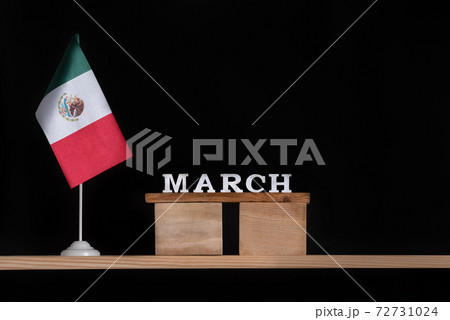 Wooden calendar of March with Mexico flag on black background. Holidays of Mexico in March 72731024