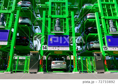 Many cars are parked in automatic multi level open space car parking lot 72733892