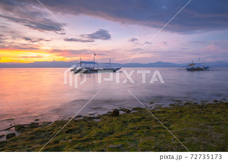 Deamatic sunset over the beach, Philippines 72735173