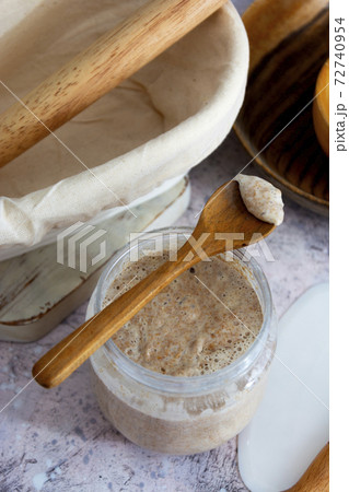 Starter sourdough. Baking homemade bread with wild sourdough and wholemeal flour. 72740954