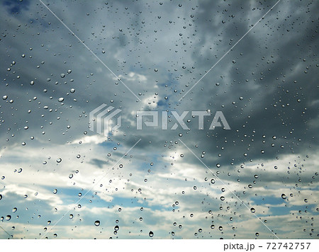 Raindrops on glass. Rainy weather. sad day. Dark sky 72742757