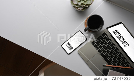Worktable with laptop, smartphone, coffee cup and copy space in hoe office room 72747059