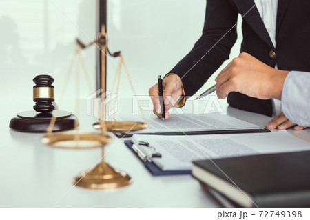 Judge is working in the office of the court of Justice. 72749398