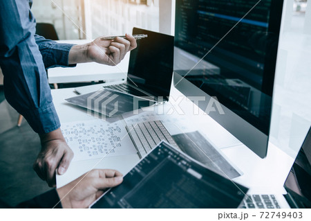 Professional development programmer cooperating meeting programming website working a software in office room. Professional development programmer cooperating meeting programming website working a software in office room. 72749403