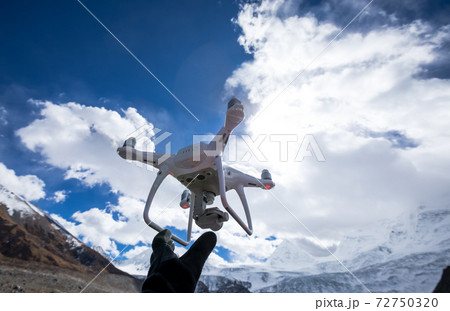 Flying drone taking picture of glacier lagoon in Tibet,China 72750320