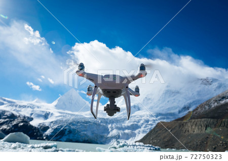 Flying drone taking picture of glacier lagoon in Tibet,China 72750323