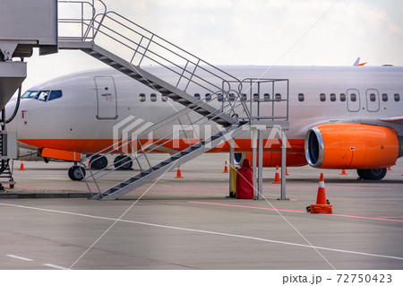 Making landing at the airport, plane and airport, the plane on the runway. Making landing at the airport, plane and airport, the plane on the runway. 72750423