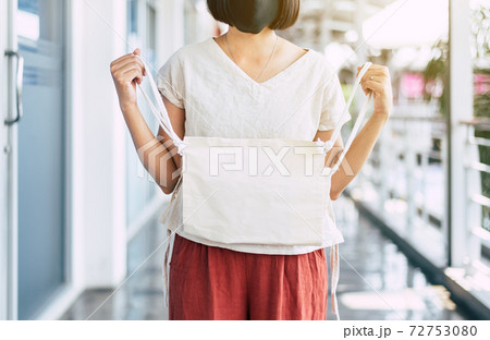 Woman holding reusable eco bag,Healthy green,Environmental friendly,Zero waste,Conscious lifestyle concept Woman holding reusable eco bag,Healthy green,Environmental friendly,Zero waste,Conscious lifestyle concept 72753080