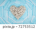 White heart on a background of a blue faces masks. Concept of a Valentines day during Coronavirus or Covid pandemic. 72753512