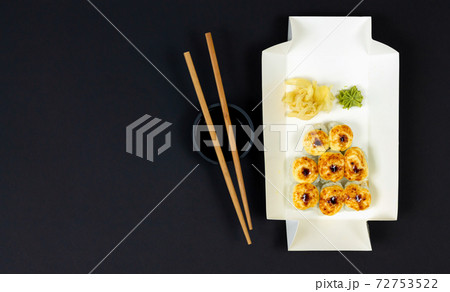 Hot baked sushi rolls in eco disposable box for take away 72753522