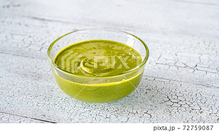 Bowl of pistachio butter 72759087