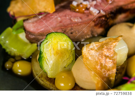 Duck breast with cauliflower puree and vegetables 72759838