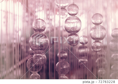 Abstract glass balls hang on threads. Abstract glass balls hang on threads. 72763228
