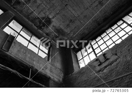 broken windows concrete wall in derelict factory broken windows concrete wall in derelict factory 72765305