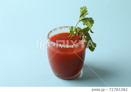 Glass of Bloody Mary on blue background Glass of Bloody Mary on blue background 72765362