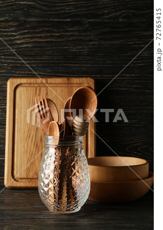 Different wooden kitchenware on wooden background, space for text Different wooden kitchenware on wooden background, space for text 72765415