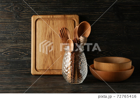 Different wooden kitchenware on wooden background, space for text 72765416