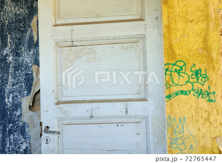 wooden door wallpaper shreds peeling wall 72765447