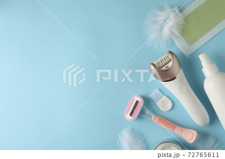 Different shaving accessories on blue background, space for text 72765611